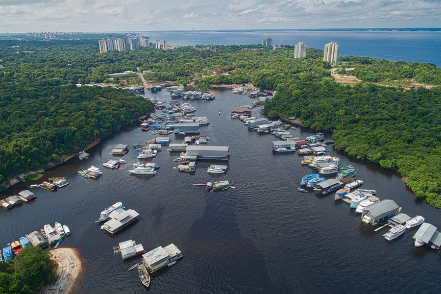 Manaus waterfront with floating houses and boats